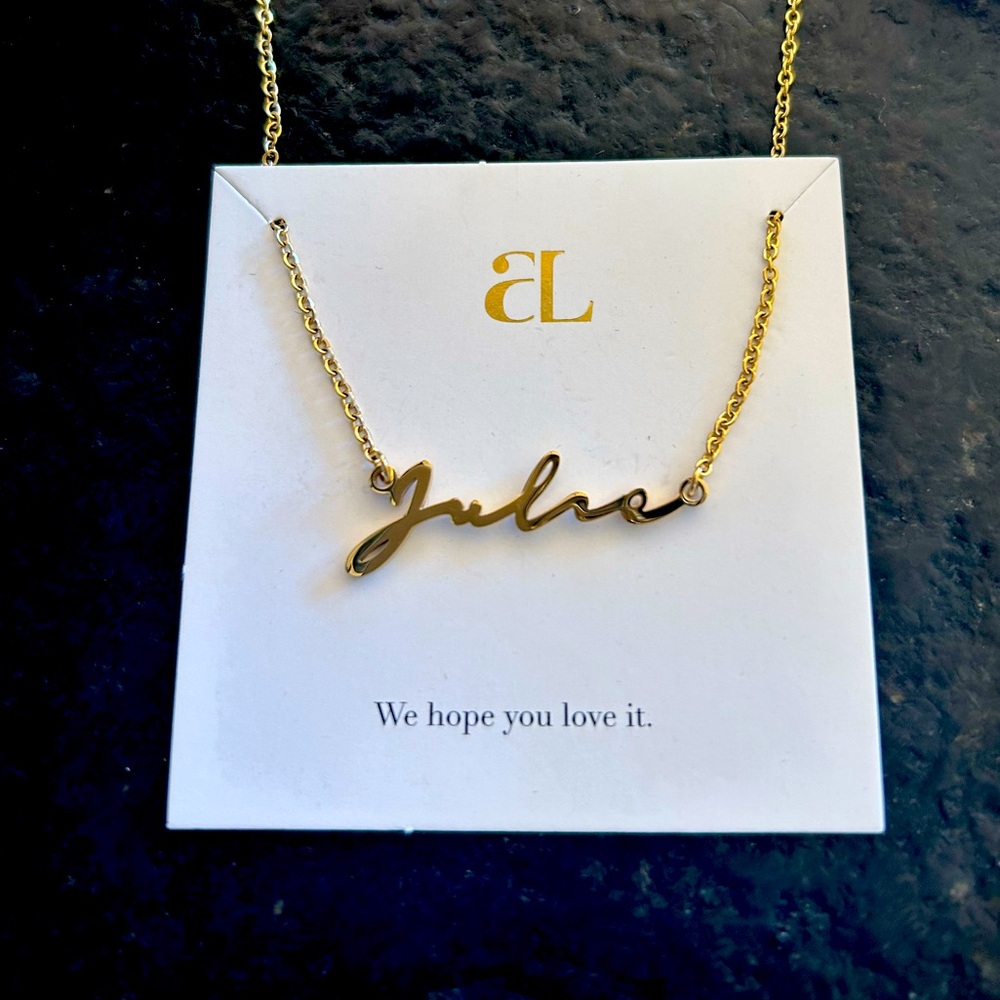 Personalized Julie waterproof necklace.  Comes withh original box and papers.